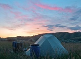 Meadow and tent at sunset - Upper Missouri River Breaks National Monument, Montana