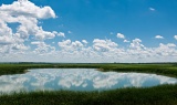 Sky reflected in prairie pothole lake - Forman, North Dakota