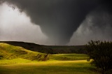 Cone tornado and sunlit field - Faith, South Dakota