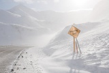 Dalton Highway with blowing snow - Atigun Pass, Alaska