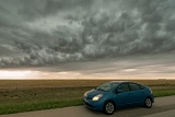 Prius under whale's mouth cloud - Springfield, Colorado